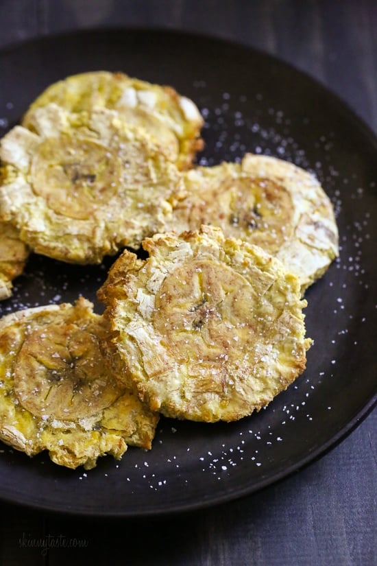 These easy tostones also known as patacones or fried green plantains are made healthier in the air fryer. No deep frying, just a few spritzes of olive oil for a crispy, delicious appetizer or side dish.