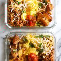 Breakfast lovers, jazz up your mornings with this Meal Prep Breakfast Taco Scramble, made with potatoes, turkey taco meat, scrambled eggs and salsa (cheese is optional!) perfect to make ahead for breakfast for the week!