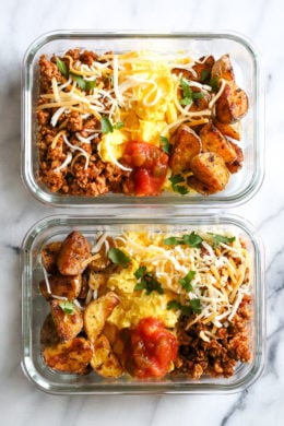 Breakfast lovers, jazz up your mornings with this Meal Prep Breakfast Taco Scramble, made with potatoes, turkey taco meat, scrambled eggs and salsa (cheese is optional!) perfect to make ahead for breakfast for the week!