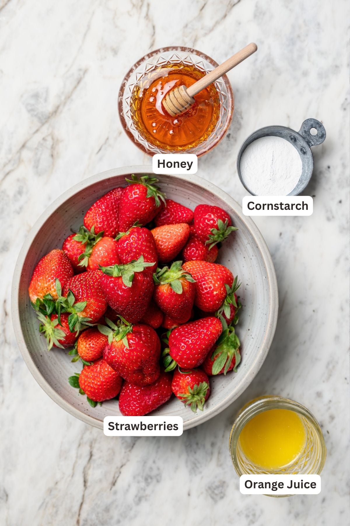 Overhead view of ingredients for strawberry crisp filling