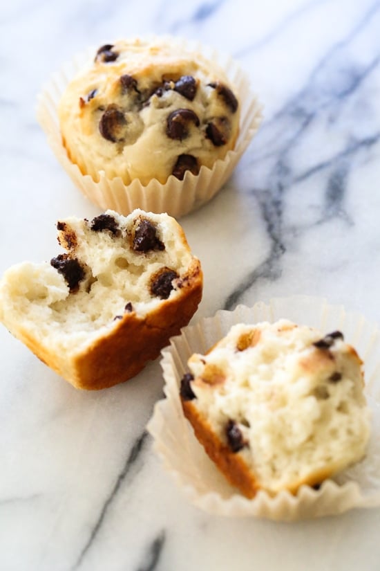 These easy chocolate chip muffins are moist and high in protein thanks to the addition of Greek yogurt. The perfect to make ahead breakfast! Healthy chocolate chip muffins on marble countertop