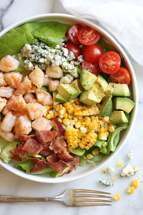 This hearty Chopped Salad with Shrimp, Avocado, Blue Cheese and Bacon is simple and satisfying. Great for lunch or dinner!