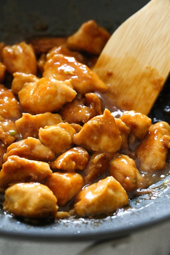 Stirring General Tso's chicken in wok