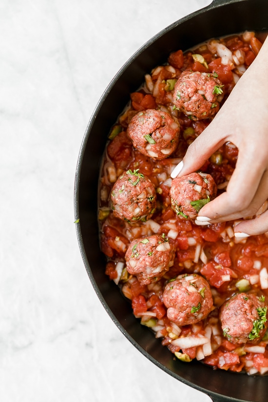 Moroccan Kefta Meatballs made with tomatoes and olives are simmered together in the slow cooker or Instant Pot in this easy and exotic Moroccan dinner.
