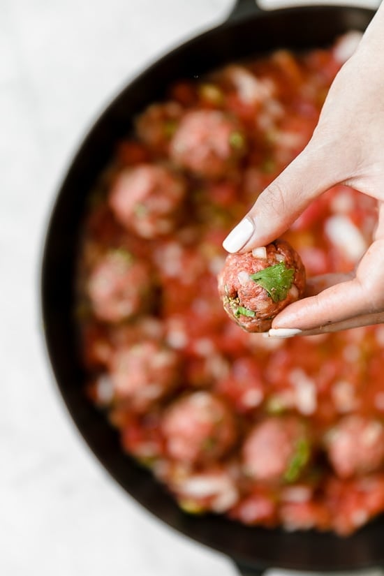 Moroccan Kefta Meatballs made with tomatoes and olives are simmered together in the slow cooker or Instant Pot in this easy and exotic Moroccan dinner.