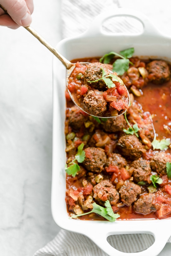 Moroccan Kefta Meatballs made with tomatoes and olives are simmered together in the slow cooker or Instant Pot in this easy and exotic Moroccan dinner.