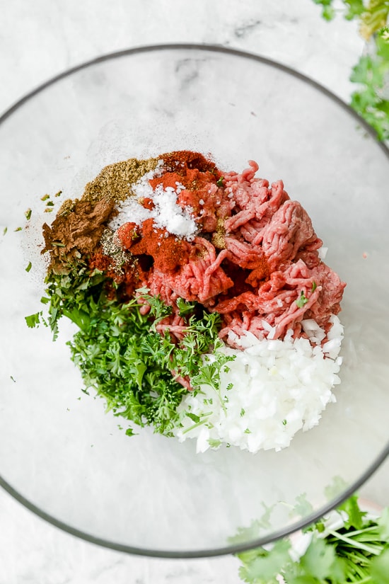 Moroccan Kefta Meatballs made with tomatoes and olives are simmered together in the slow cooker or Instant Pot in this easy and exotic Moroccan dinner.