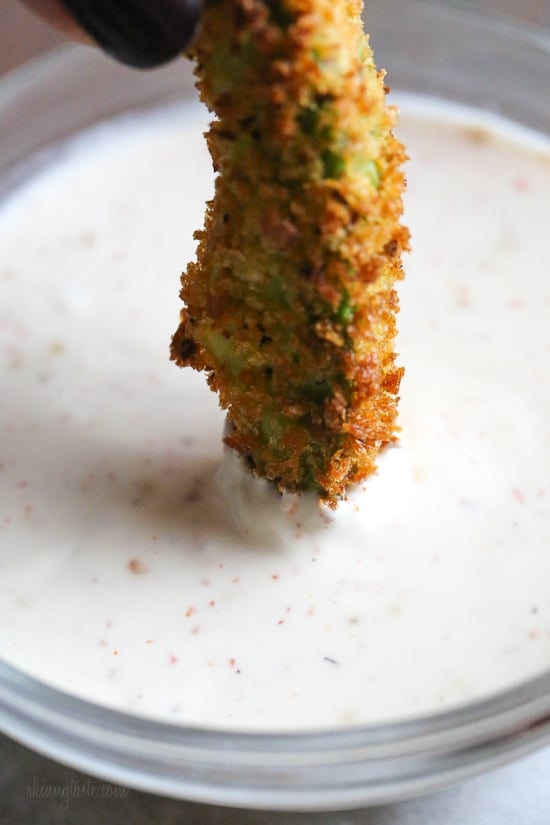 Crispy baked avocado fries coated with panko breadcrumbs with a lime dipping sauce. So fast and easy to make in the oven or air fryer!