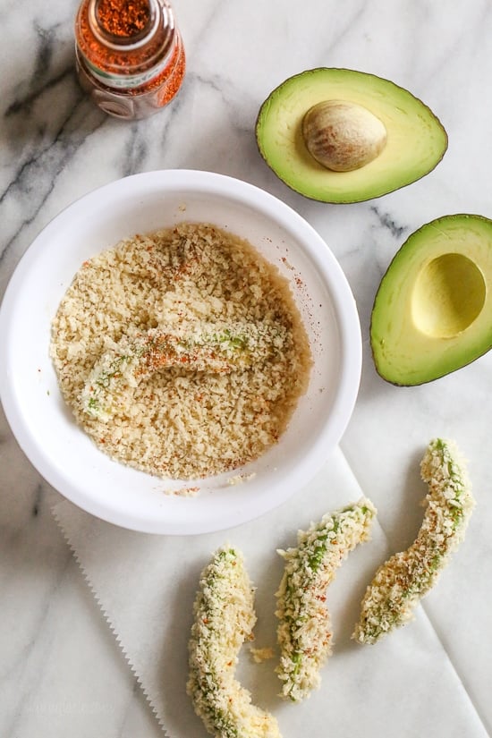 Crispy baked avocado fries coated with crispy panko breadcrumbs with a lime dipping sauce. So fast and easy to make in the oven or air fryer!