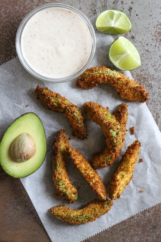 Crispy baked avocado fries coated with crispy panko breadcrumbs with a lime dipping sauce. So fast and easy to make in the oven or air fryer!