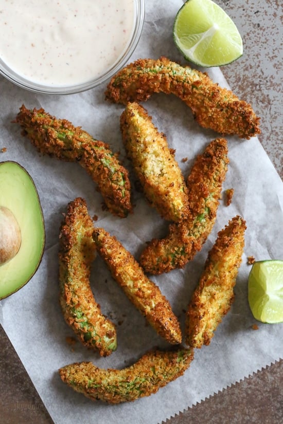Crispy baked avocado fries coated with crispy panko breadcrumbs with a lime dipping sauce. So fast and easy to make in the oven or air fryer!