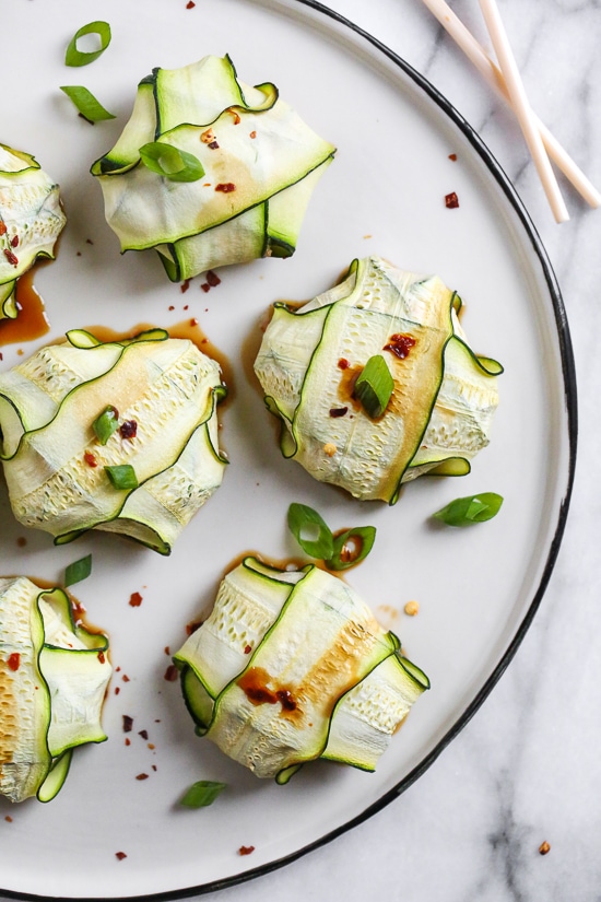 These low-carb pork dumplings, made with zucchini in place of dough are so dang good, you won't miss the carbs! They are also keto, paleo, gluten-free and whole30 friendly!