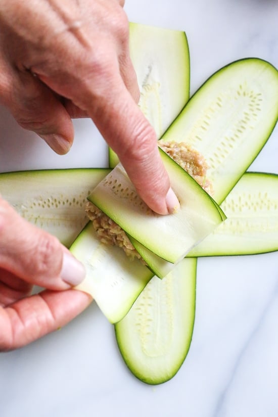 These low-carb pork dumplings, made with zucchini in place of dough are so dang good, you won't miss the carbs! They are also keto, paleo, gluten-free and whole30 friendly!