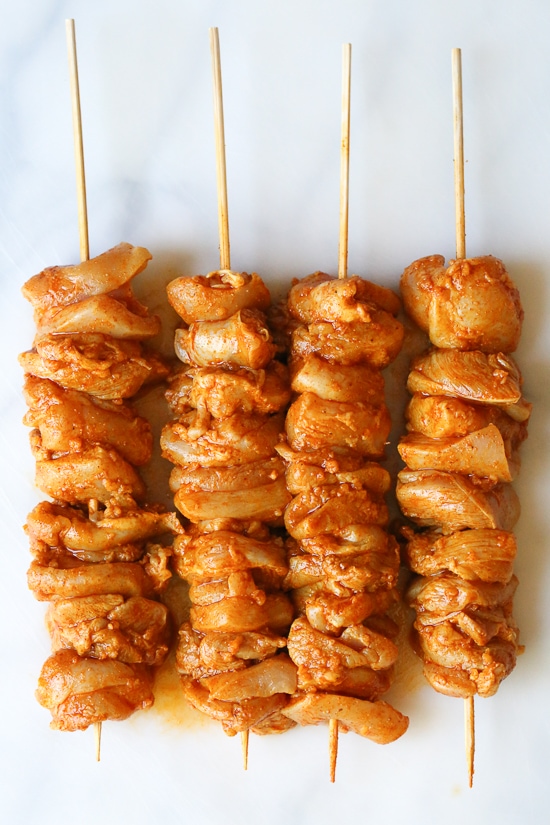 This Mediterranean inspired salad is made with Grilled Chicken Shawarma kebabs served over salad with Feta and Tzatziki.