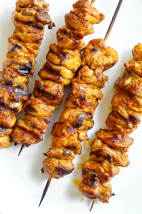 This Mediterranean inspired salad is made with Grilled Chicken Shawarma kebabs served over salad with Feta and Tzatziki.