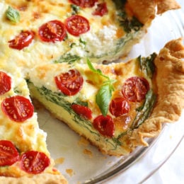 This easy vegetarian quiche recipe is made with spinach, ricotta cheese, eggs, tomatoes and basil. Perfect for breakfast, lunch or brunch or serve it with a salad for a light dinner.