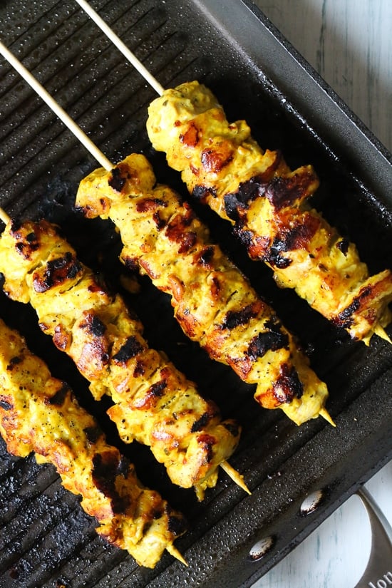 Smoky yogurt-marinated grilled chicken served over quinoa and Mediterranean-inspired tomatoes, cucumbers, and olives with tzatziki and Feta.