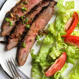 The marinade in this Grilled Asian-style Soy Marinated Flank Steak takes an uninteresting piece of steak and turns it into a mouthwatering dish!