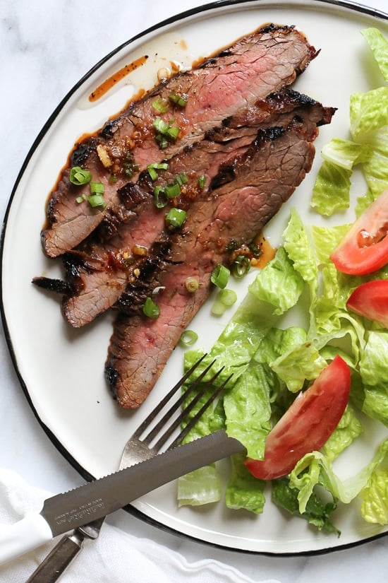 The marinade in this Grilled Asian-style Soy Marinated Flank Steak takes an uninteresting piece of steak and turns it into a mouthwatering dish!