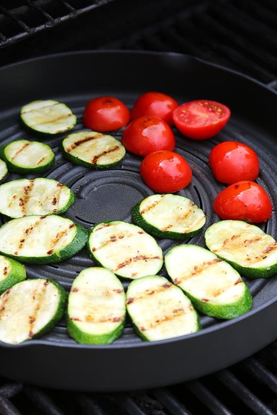 Grilled chicken, zucchini and tomatoes topped with a light spinach-arugula basil pesto served over couscous.