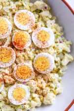 A low-carb faux "potato" salad made with cauliflower instead of potatoes, perfect for Keto or if you're just looking to eat less carbs.