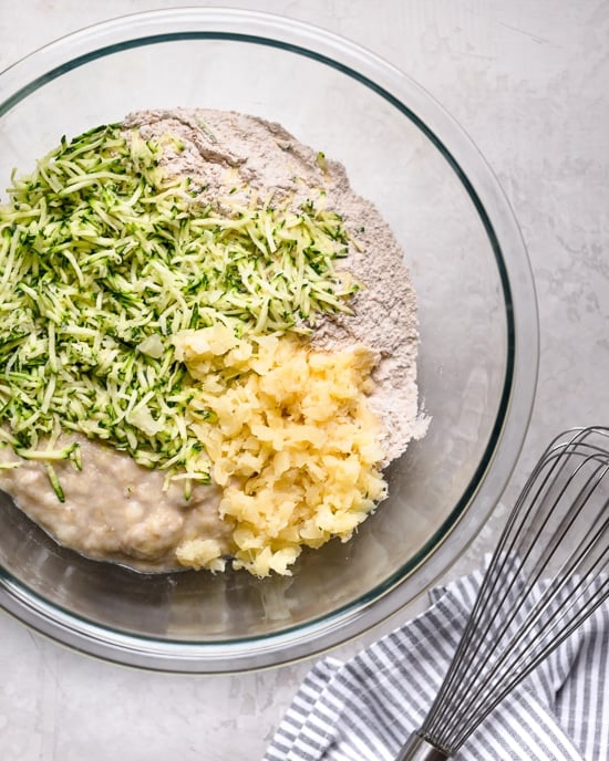 Fruity, moist and delicious, this banana and zucchini cake is loaded crushed pineapple and lightly sweetened with honey.