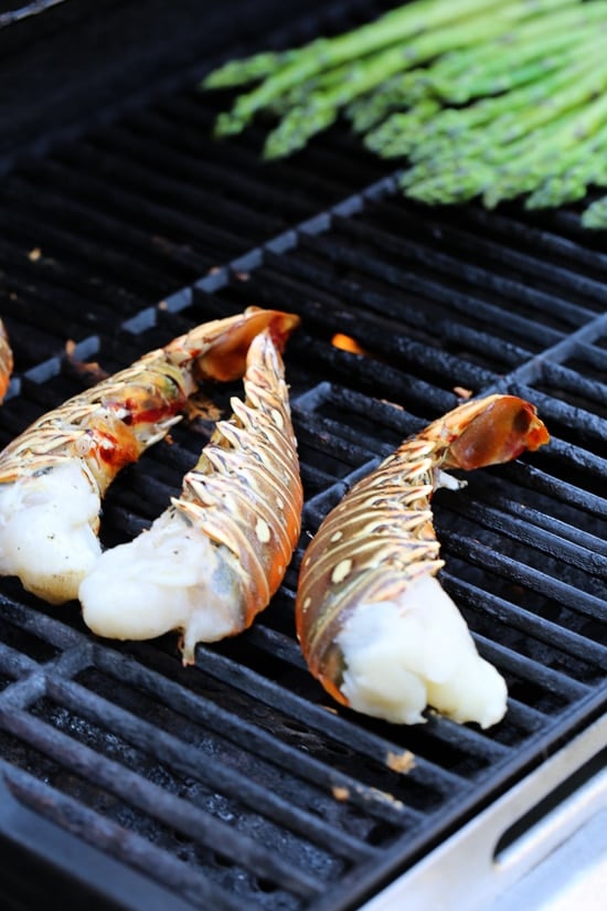 Grilled Lobster Tails topped with Herb Garlic Butter are a delicious delicacy, and grilling them is super quick and easy!