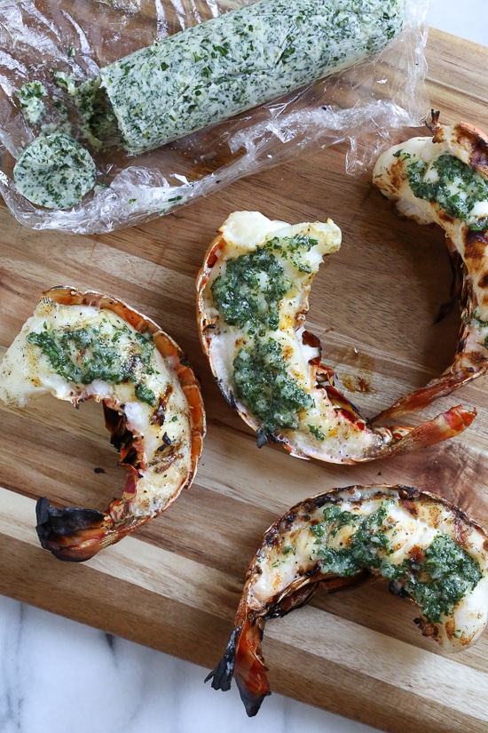 Grilled Lobster Tails topped with Herb Garlic Butter are a delicious delicacy, and grilling them is super quick and easy!