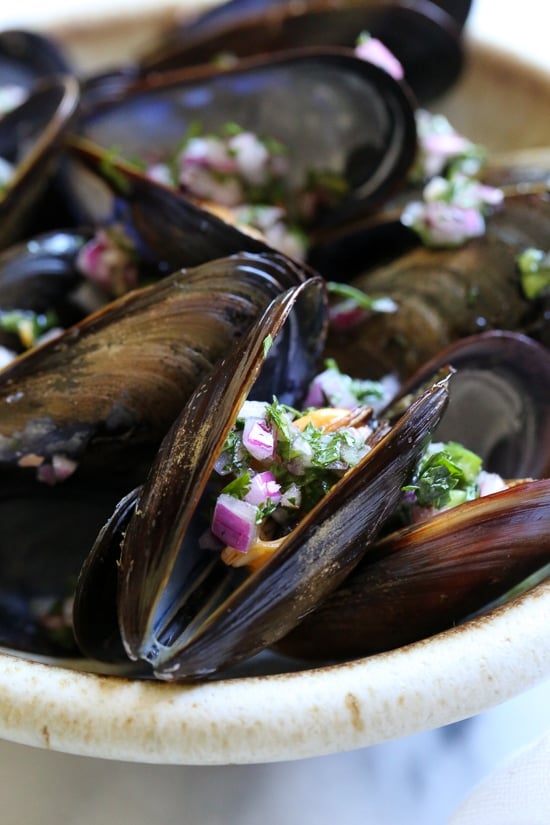 Steamed mussels get a kick with spicy Piri Piri Sauce which is basically a kicked up chimichurri sauce.