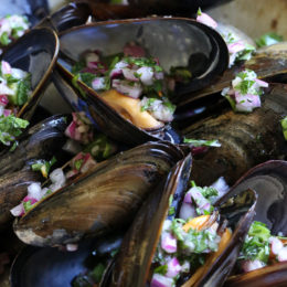 Steamed mussels get a kick with spicy Piri Piri Sauce which is basically a kicked up chimichurri sauce.