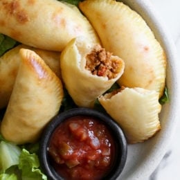 These taco empanadas are made from scratch with my ground turkey taco meat and my quick and easy pizza dough recipe!