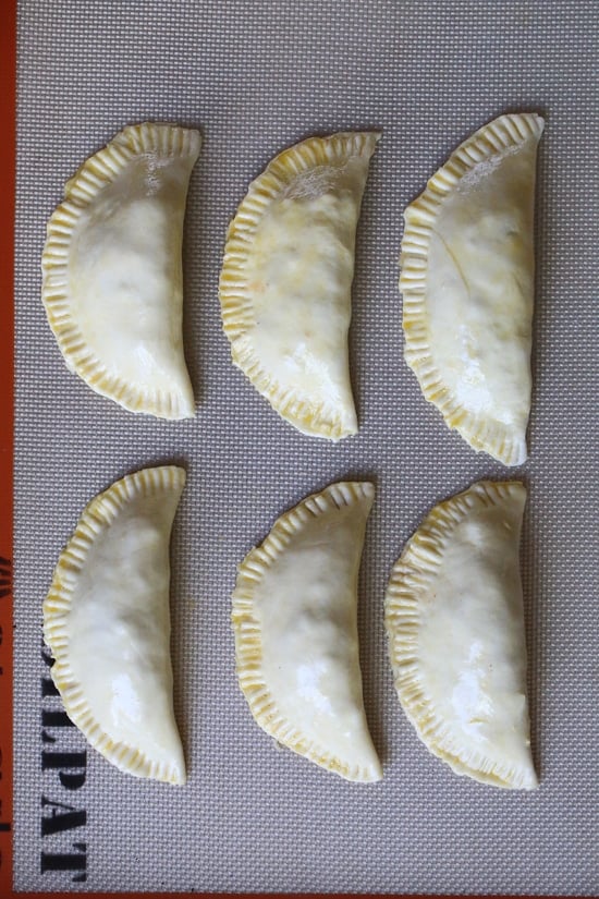 These taco empanadas are made from scratch with my ground turkey taco recipe and my quick and easy pizza dough recipe!