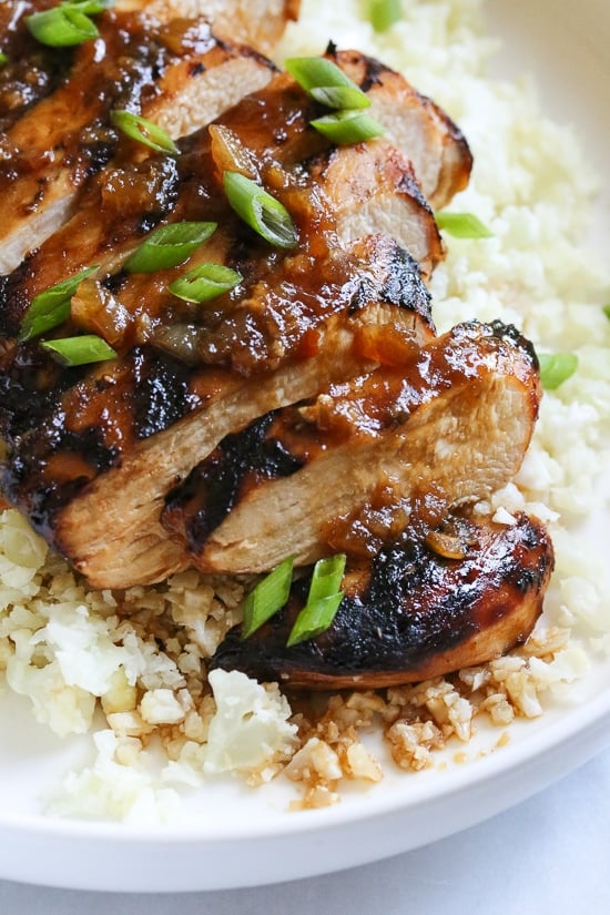Grilled Bourbon Chicken breasts are marinaded with soy sauce, Bourbon, brown sugar, ginger and spices then grilled until slightly caramelized on the outside and juicy on the inside.