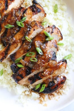 Grilled Bourbon Chicken breasts are marinaded with soy sauce, Bourbon, brown sugar, ginger and spices then grilled until slightly caramelized on the outside and juicy on the inside.