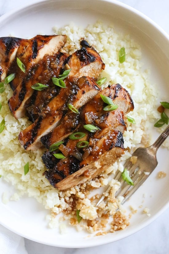 Grilled Bourbon Chicken breasts are marinaded with soy sauce, Bourbon, brown sugar, ginger and spices then grilled until slightly caramelized on the outside and juicy on the inside.