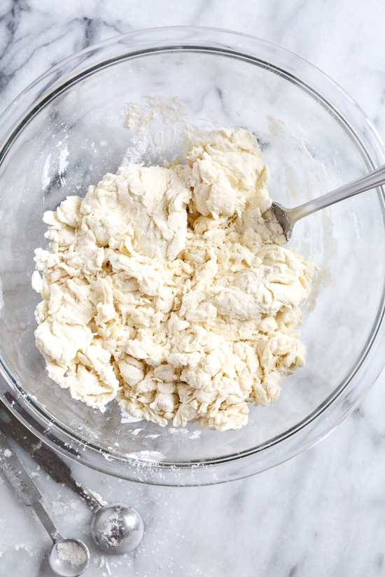 This easy Grilled Pizza is made from scratch with my easy yeast-free Greek yogurt dough, topped with sauce, mozzarella cheese and your choice of toppings. A great summer outdoor meal that whole family can enjoy!