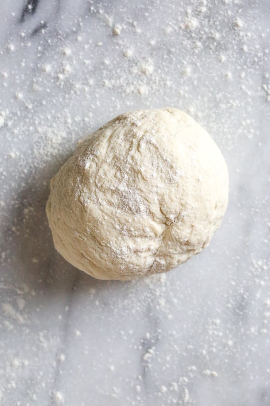 This easy Grilled Pizza is made from scratch with my easy yeast-free Greek yogurt dough, topped with sauce, mozzarella cheese and your choice of toppings. A great summer outdoor meal that whole family can enjoy!