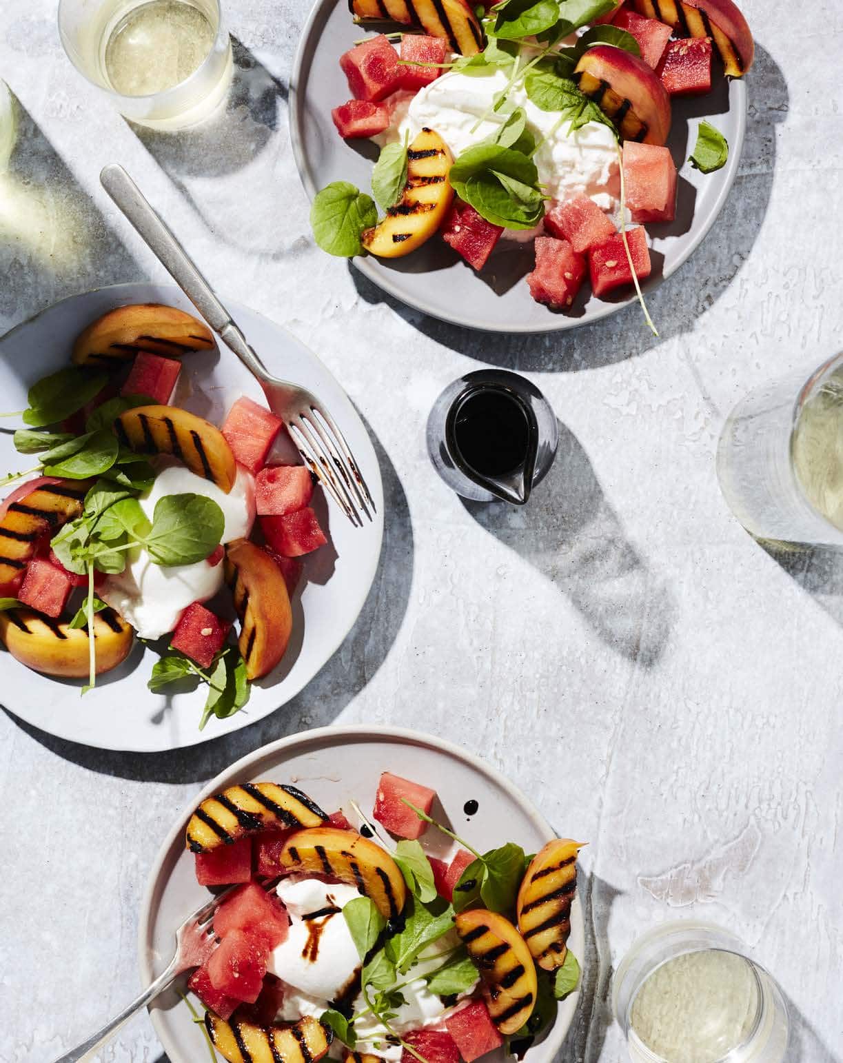 Although burrata—a fresh cheese made with mozzarella and cream—is undeniably the star of this light summer salad, the juicy grilled peaches and refreshing watermelon are pretty hard to resist.