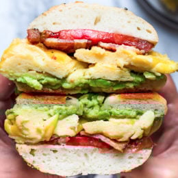 Bacon, egg and avocado on a bagel is my favorite breakfast sandwich made with scrambled eggs, center cut bacon and sliced tomatoes on my homemade bagels.