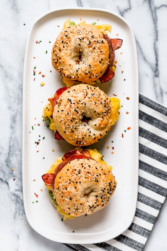 Bacon, egg and avocado on a bagel is my favorite breakfast sandwich made with scrambled eggs, center cut bacon and sliced tomatoes on my homemade bagels.
