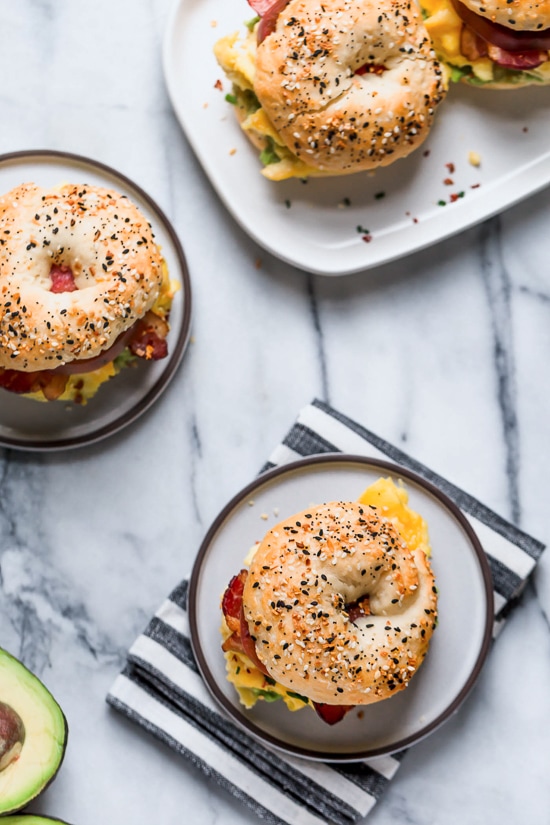 Bacon, egg and avocado on a bagel is my favorite breakfast sandwich made with scrambled eggs, center cut bacon and sliced tomatoes on my homemade bagels.