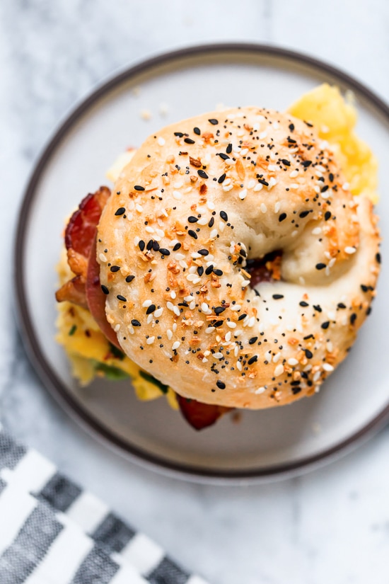 Bacon, egg and avocado on a bagel is my favorite breakfast sandwich made with scrambled eggs, center cut bacon and sliced tomatoes on my homemade bagels.