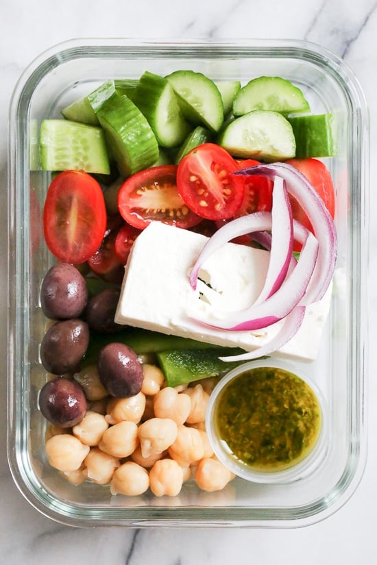 Greek Chickpea Salad, made with chickpeas, cucumbers, tomatoes, bell peppers, olives and Feta is perfect to make ahead, for lunch for the week!