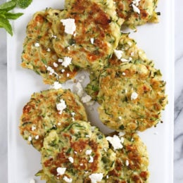 Zucchini and Feta Fritters, a fabulous summer side dish to make great use of in-season zucchini and mint.