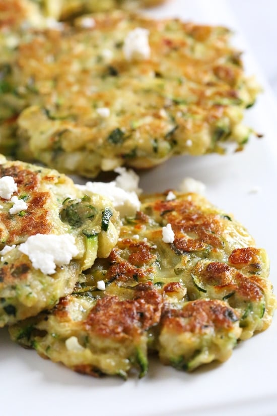 Zucchini and Feta Fritters, a fabulous summer side dish to make great use of in-season zucchini and mint.