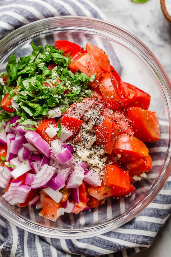 Ripe, end-of-summer garden tomatoes make the best, juiciest tomato salad, perfect served with a rustic loaf of bread!
