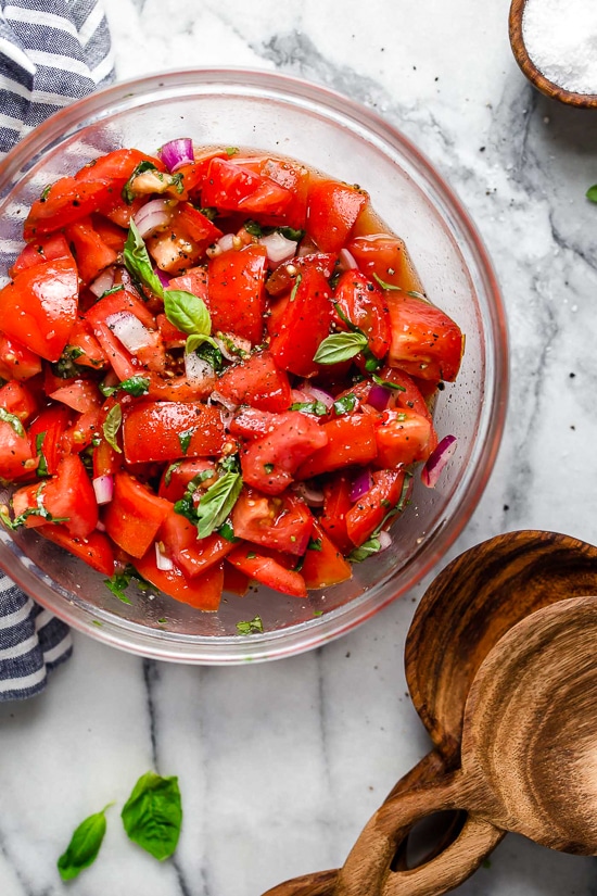 Ripe, end-of-summer garden tomatoes make the best, juiciest tomato salad, perfect served with a rustic loaf of bread!