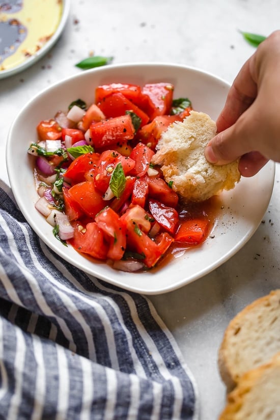 Ripe, end-of-summer garden tomatoes make the best, juiciest tomato salad, perfect served with a rustic loaf of bread!
