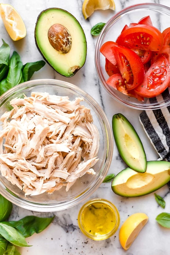 This quick and easy chicken salad is made with the breast meat of a Rotisserie chicken, avocados, fresh tomatoes, basil and lemon juice.