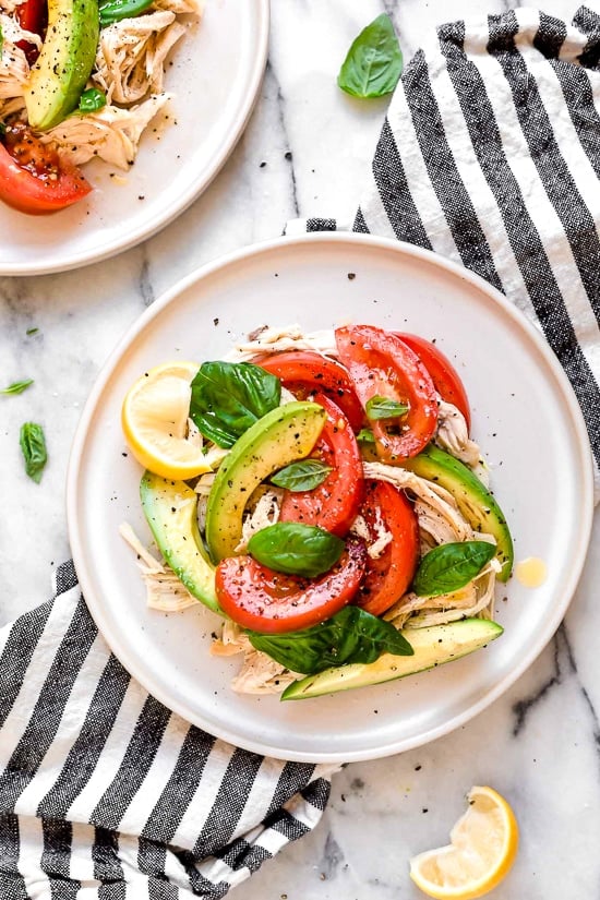 This quick and easy chicken salad is made with the breast meat of a Rotisserie chicken, avocados, fresh tomatoes, basil and lemon juice.